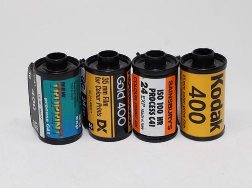 Four 35mm film rolls - rolls, of