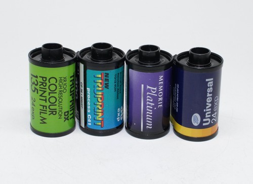 Four 35mm film rolls - film, of